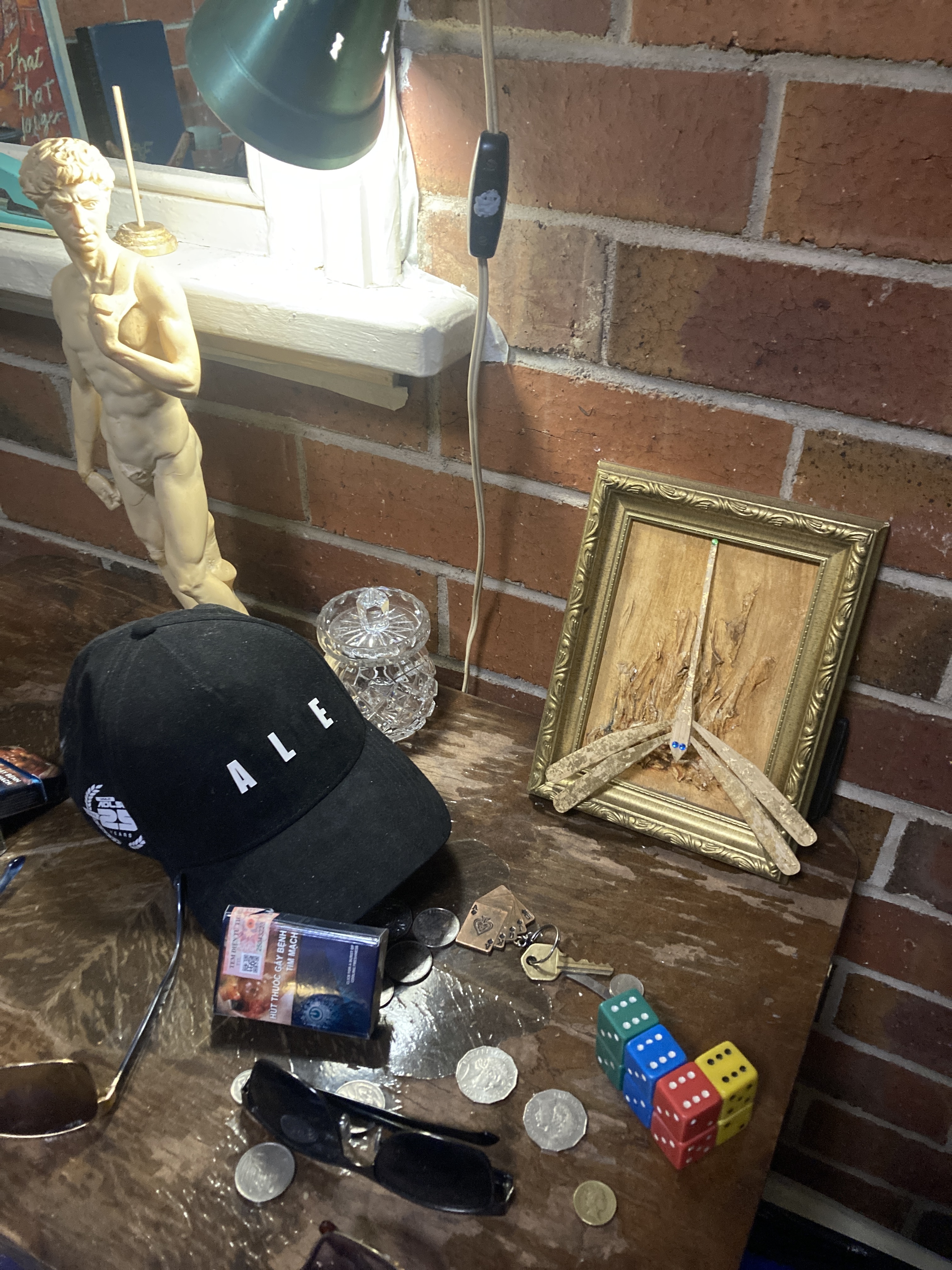 Adelelaid racing car cap with letters removed that spell A L E .